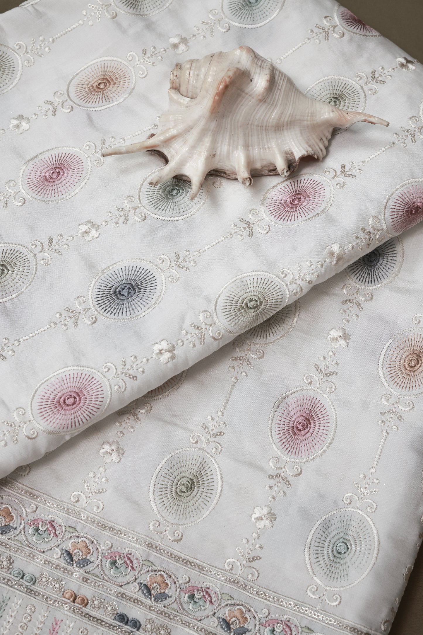 Embroidered Fabric with Circular and Floral Motifs