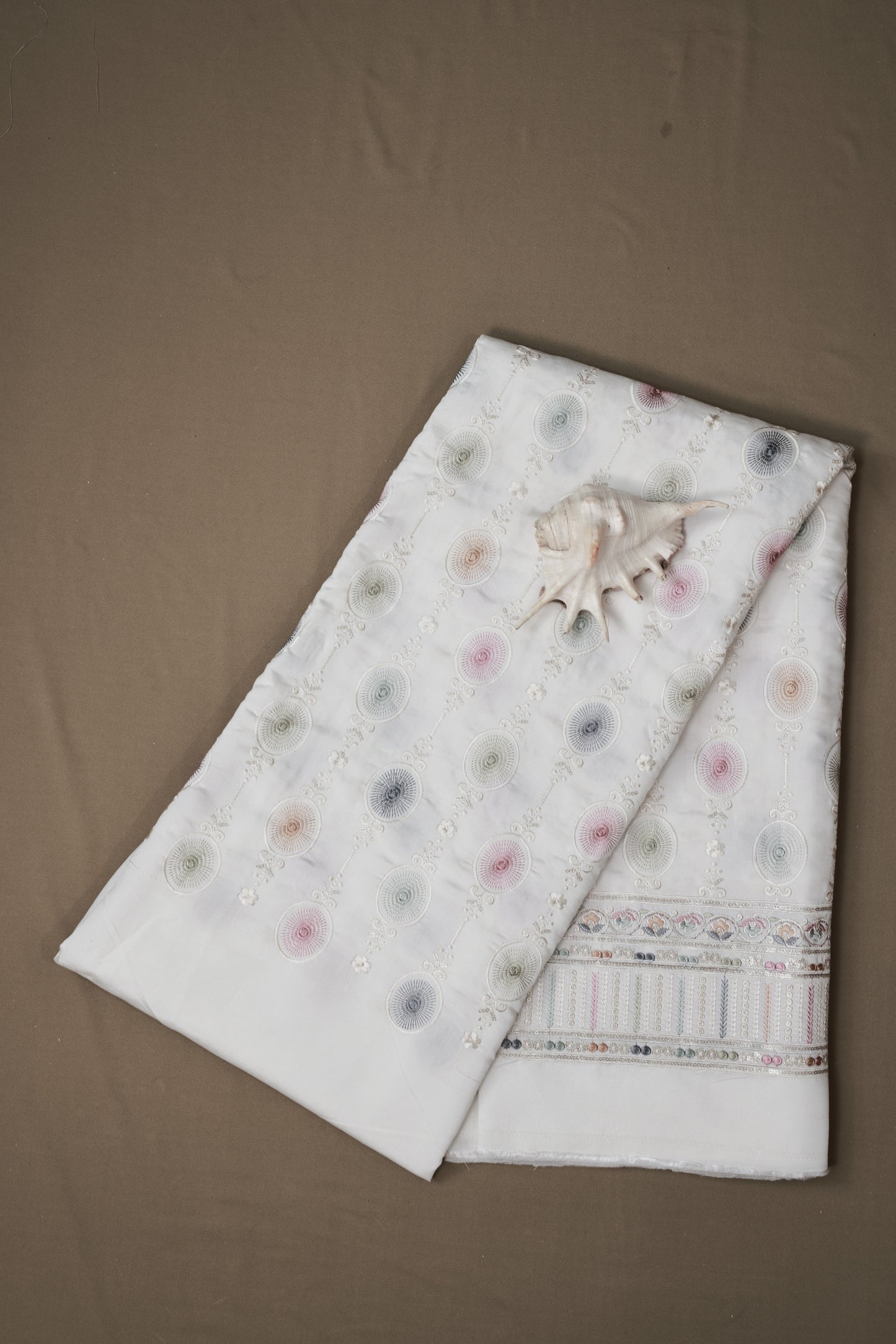 Embroidered Fabric with Circular and Floral Motifs