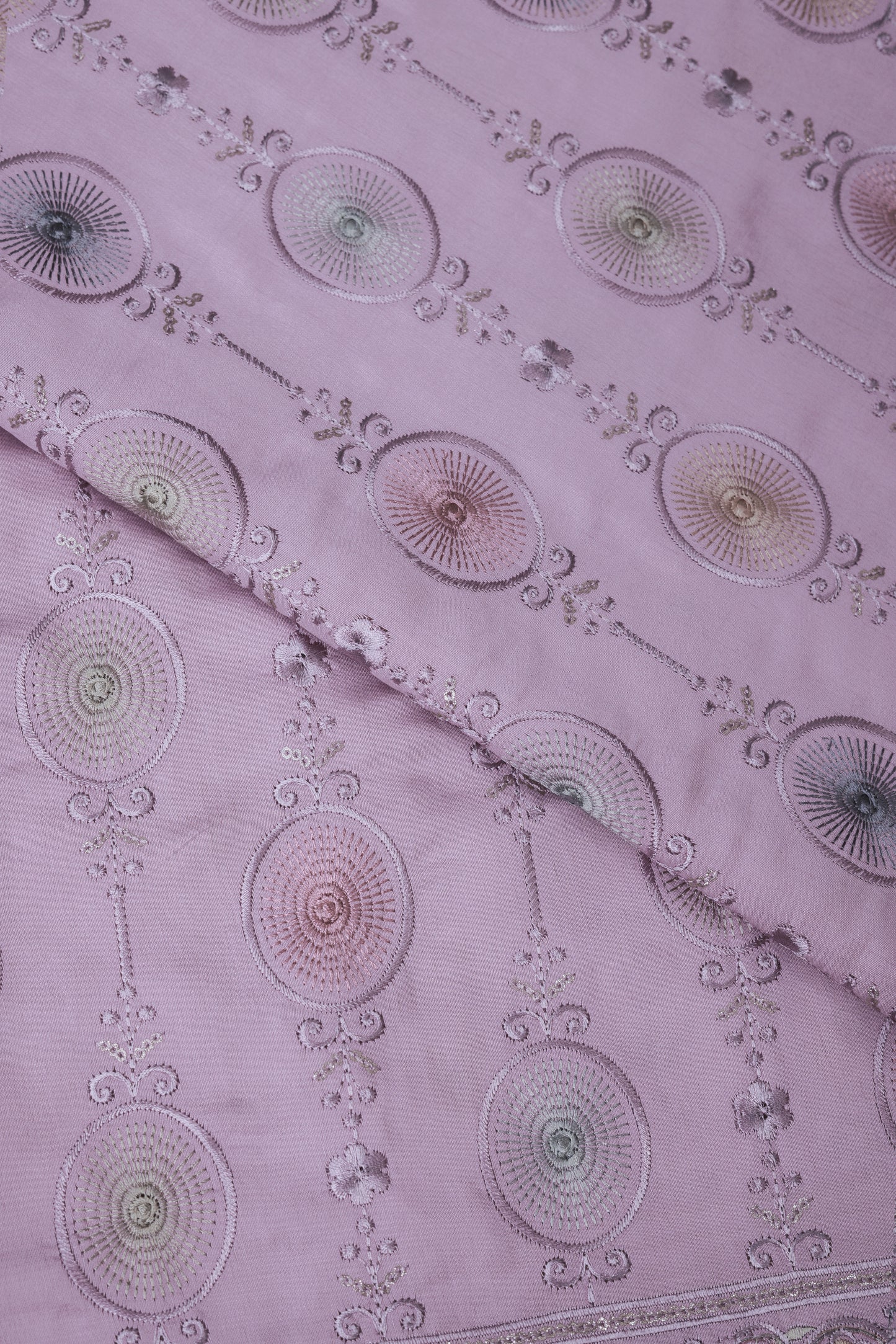 Embroidered Fabric with Circular and Floral Motifs