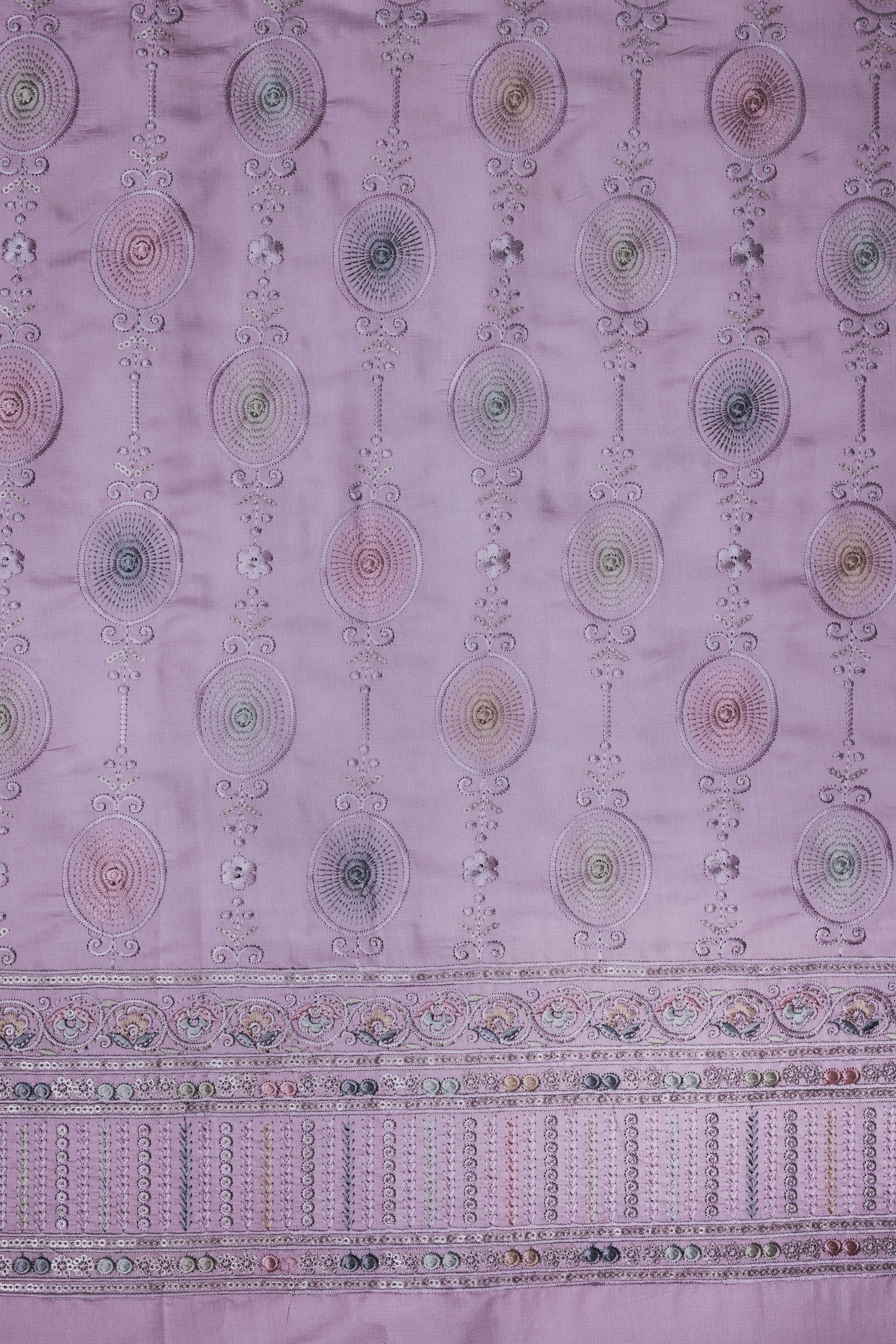 Embroidered Fabric with Circular and Floral Motifs